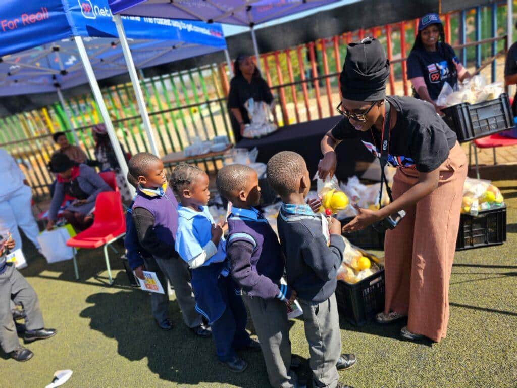 Bekkersdal & Simunye school shoe drive- Giving food to kids